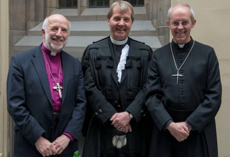 Archbishop Justin prays with mourners waiting to see the Queen lying in state 